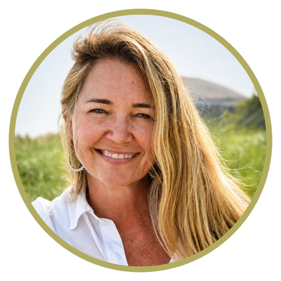 Headshot of Edi Nelson, a pediatric occupational therapist smiling outdoors